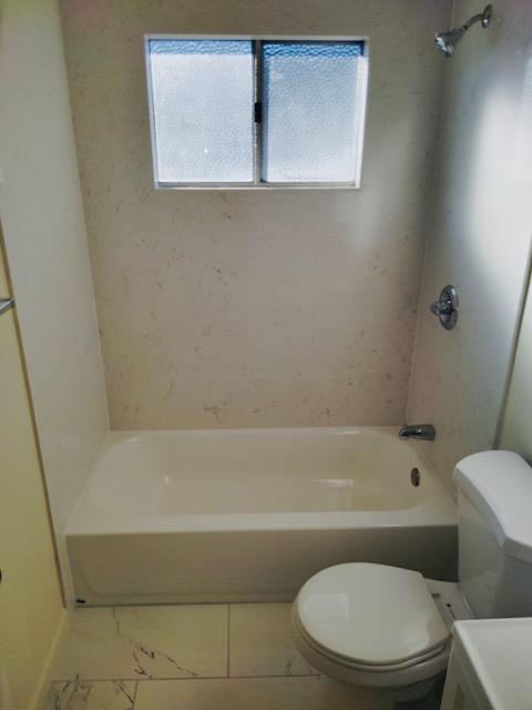 5960 Walerga Road, Unit 4 Sacramento, CA 95842 - Photo 8 of 9 a bathroom with a toilet and a bathtub