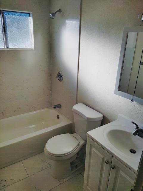 5960 Walerga Road, Unit 4 Sacramento, CA 95842 - Photo 9 of 9 a bathroom with a sink a toilet and bathtub