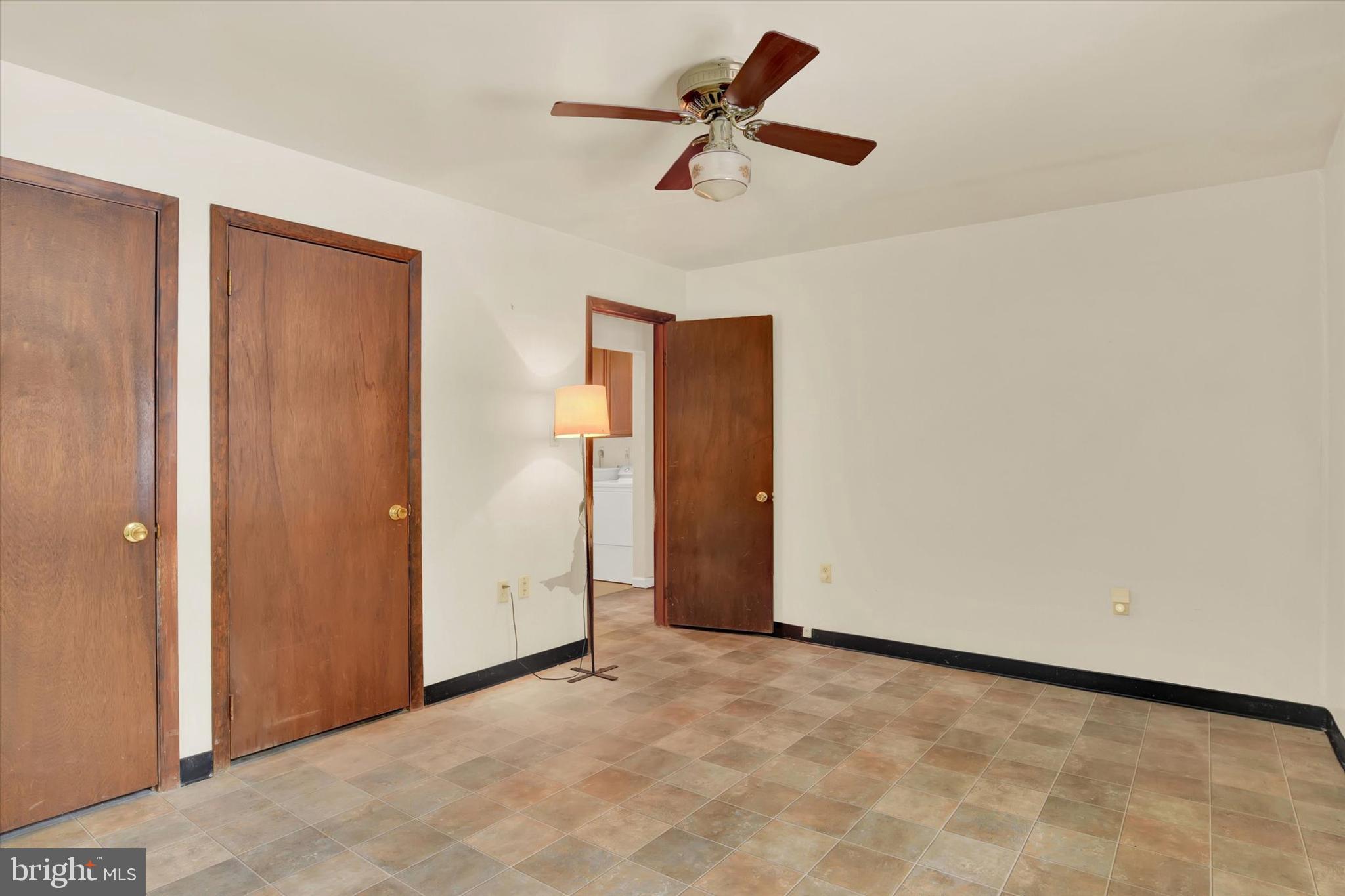 1336 Piketown Road Harrisburg, PA 17112 - Photo 16 of 29 an empty room with a ceiling fan and window