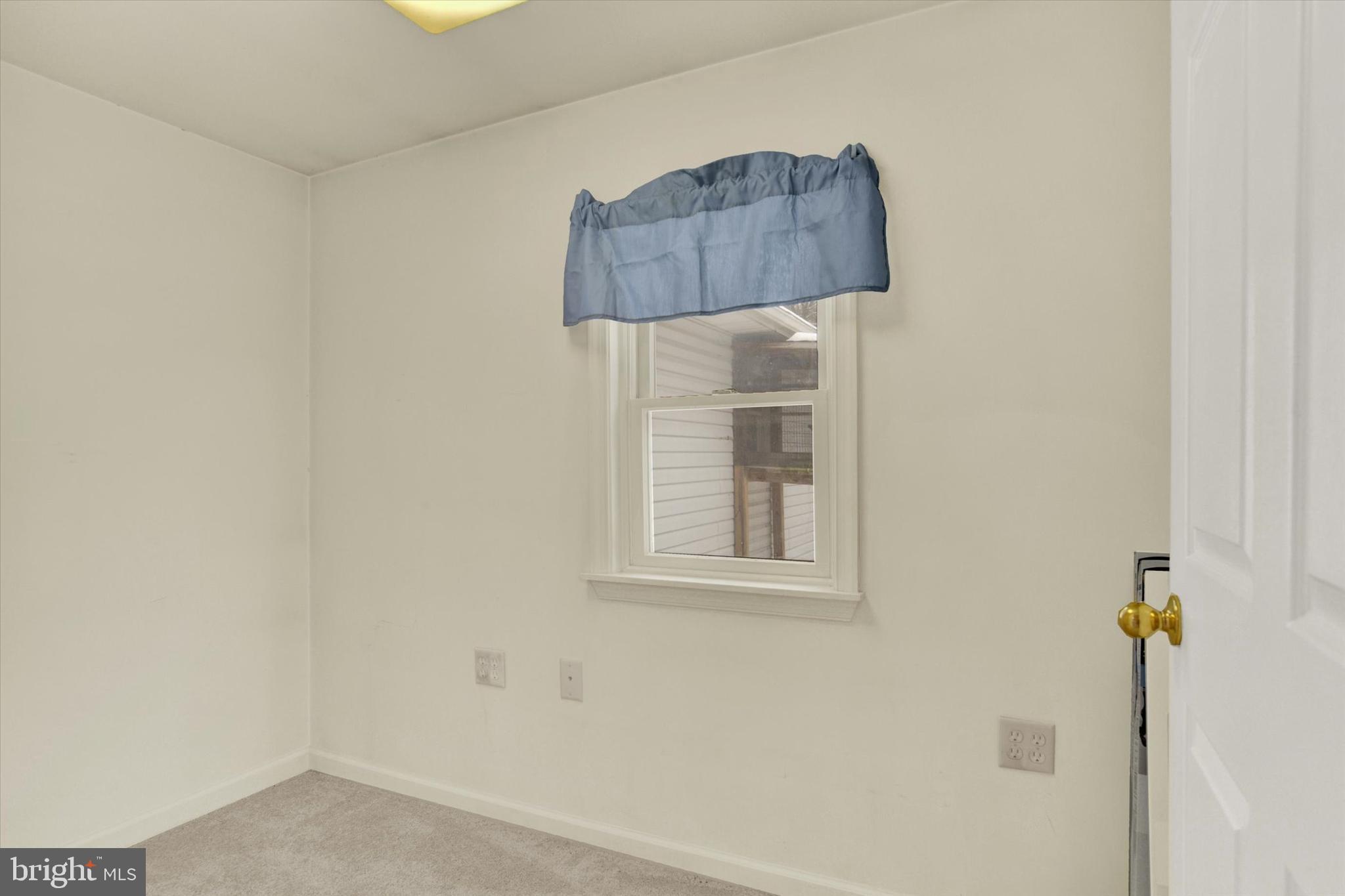 1336 Piketown Road Harrisburg, PA 17112 - Photo 18 of 29 a bathroom with a shower curtain and a window