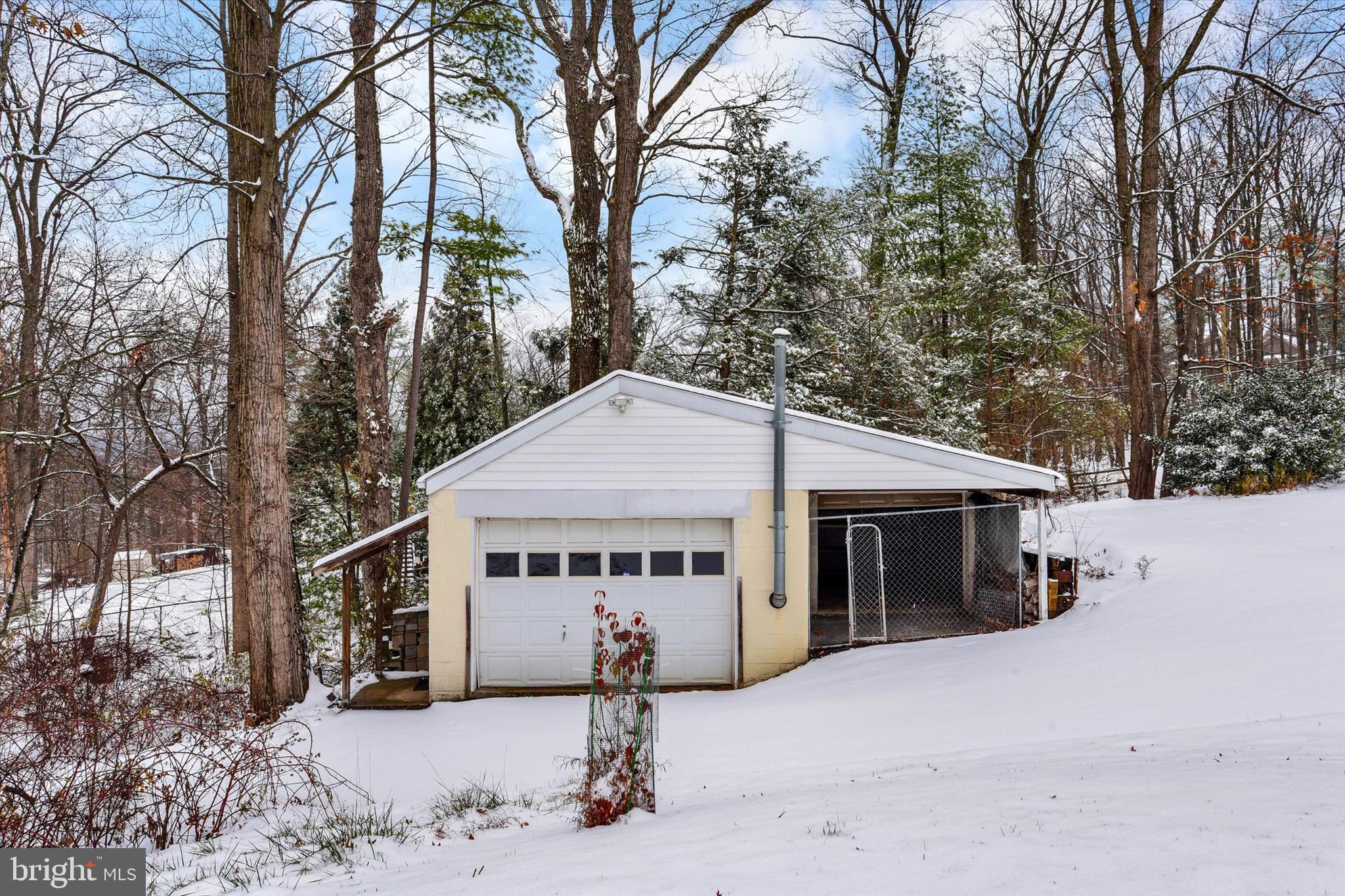 1336 Piketown Road Harrisburg, PA 17112 - Photo 27 of 29 a view of a house with a yard covered in snow