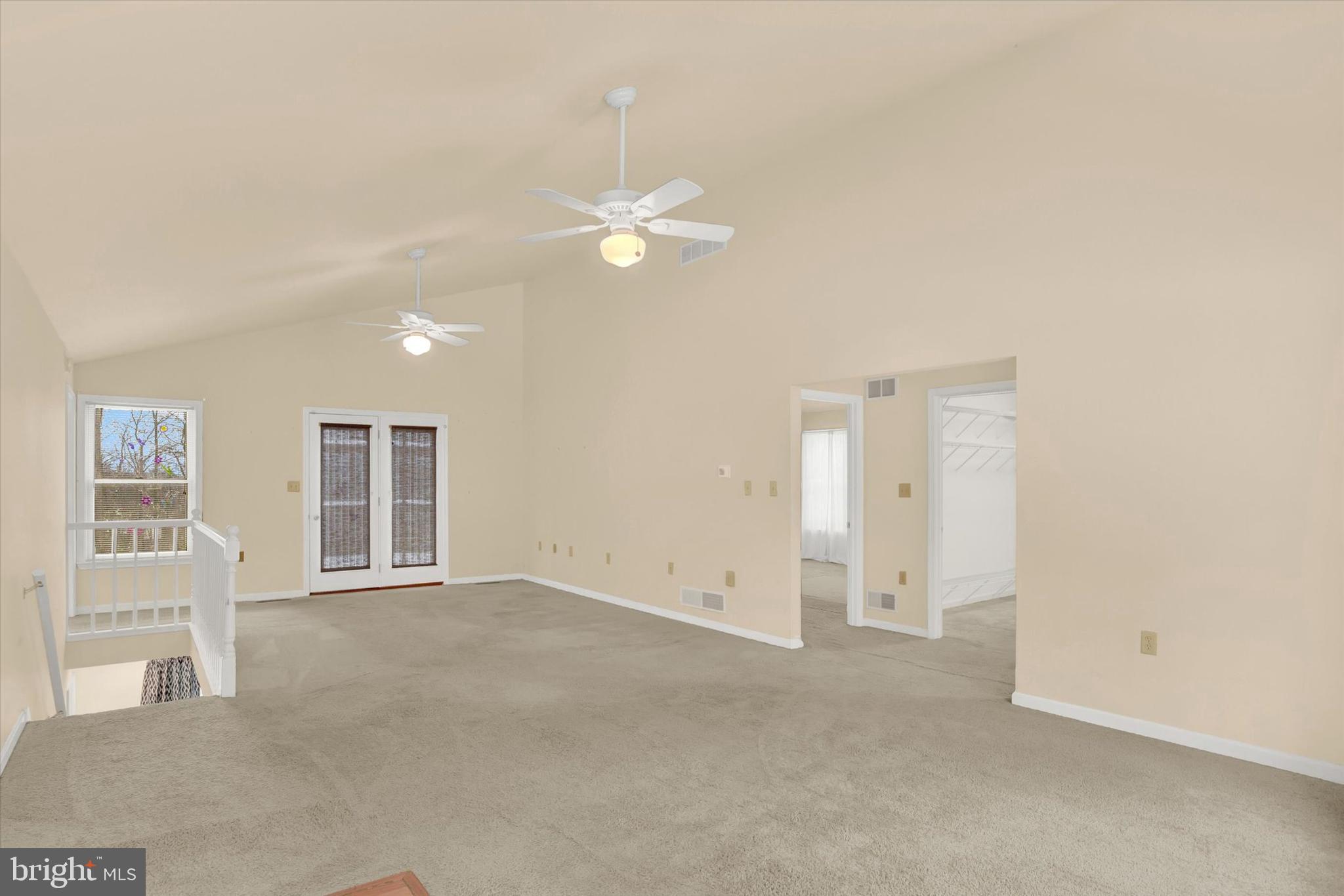 1336 Piketown Road Harrisburg, PA 17112 - Photo 4 of 29 an empty room with windows and ceiling fan