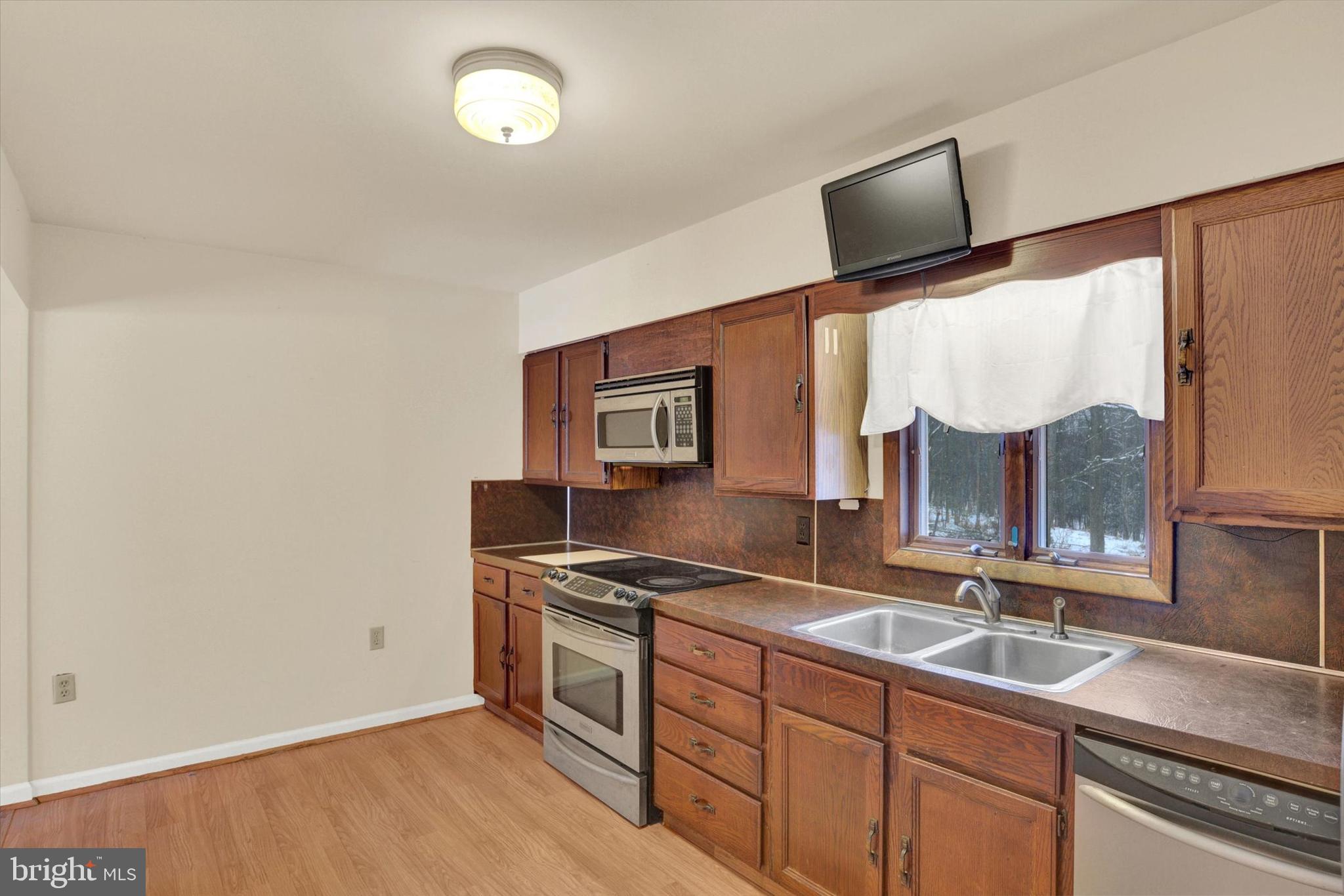 1336 Piketown Road Harrisburg, PA 17112 - Photo 5 of 29 a kitchen with stainless steel appliances a sink and a stove