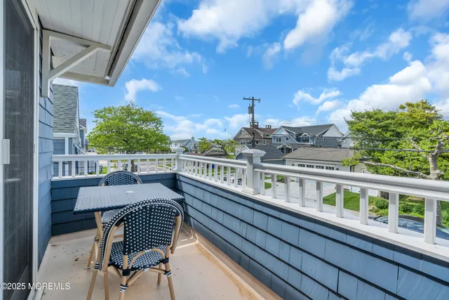 a view of a balcony with chairs