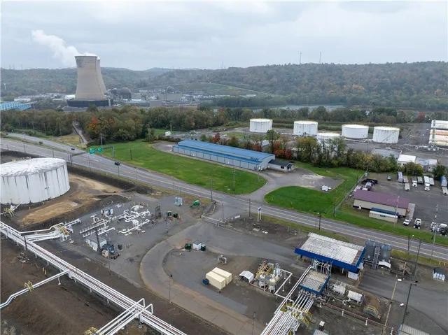 a view of a house with a yard and a large window