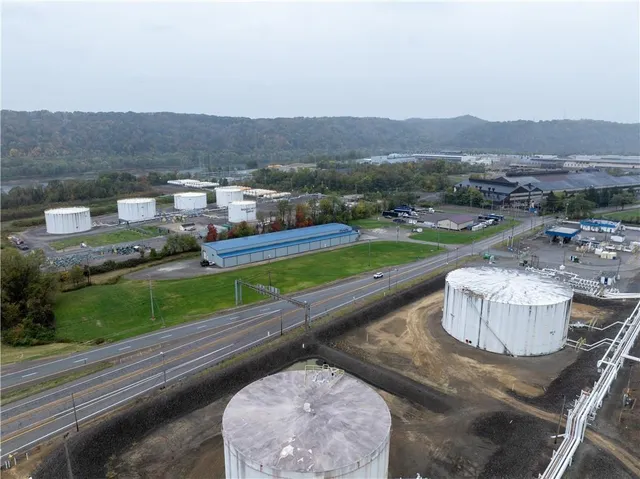 an aerial view of a house with outdoor space