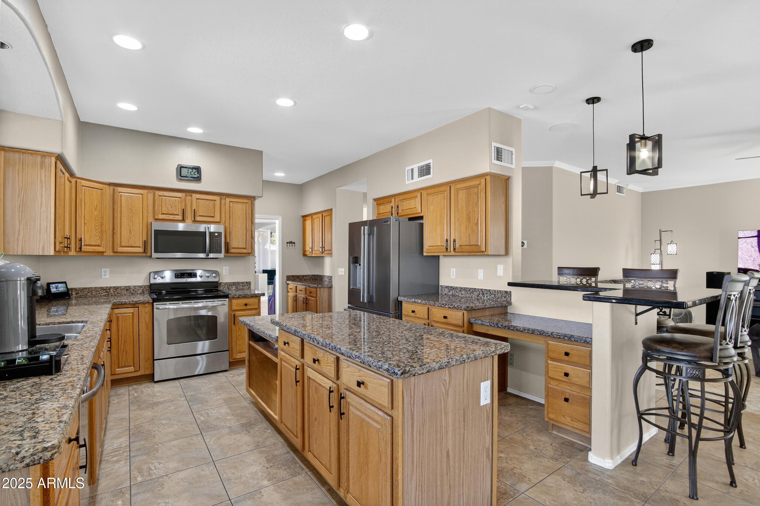 1614 East Kathleen Road Phoenix, AZ 85022 - Photo 11 of 30 a large kitchen with stainless steel appliances granite countertop a stove and a sink
