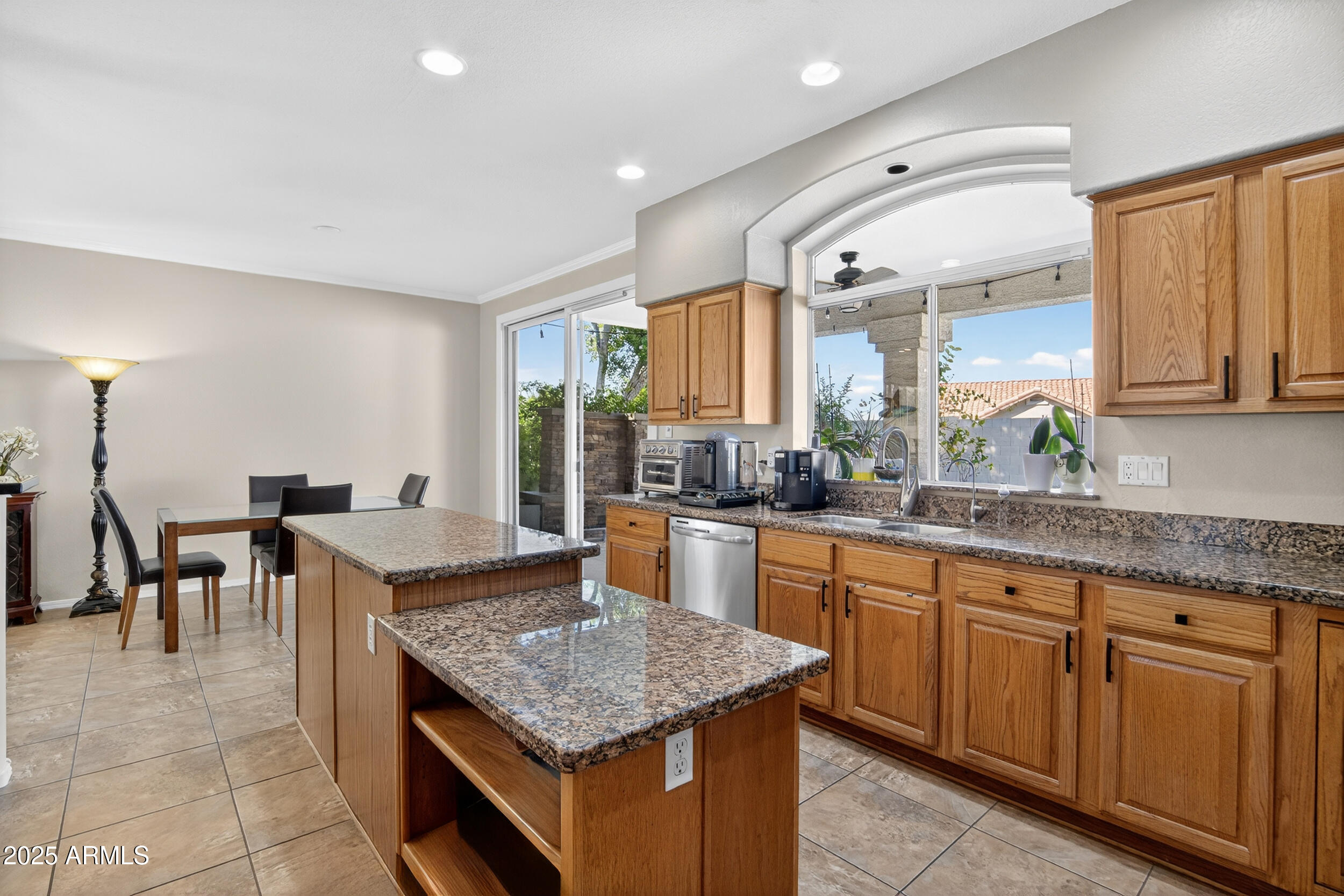 1614 East Kathleen Road Phoenix, AZ 85022 - Photo 12 of 30 a kitchen with granite countertop lots of counter top space and dining table