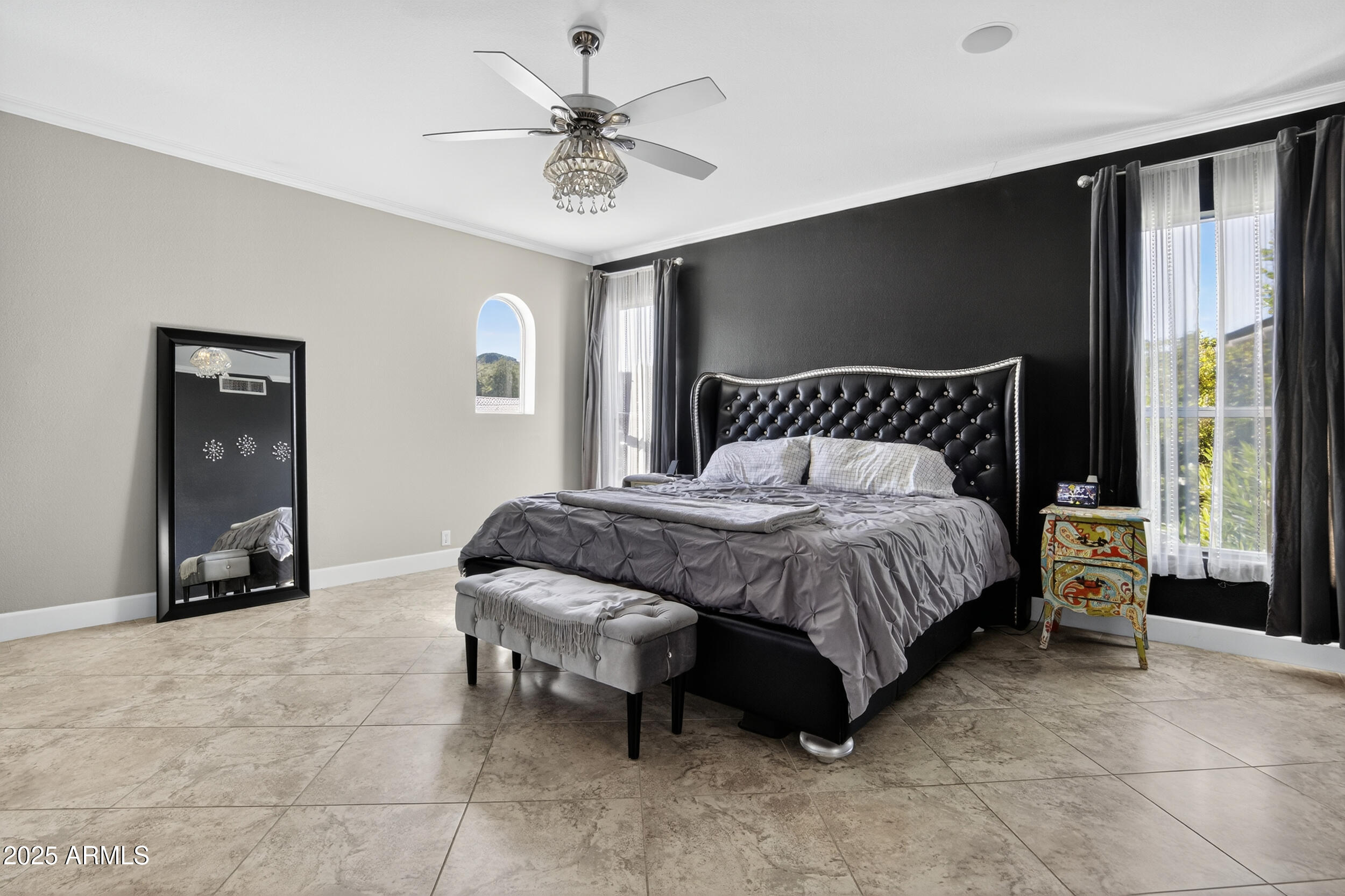 1614 East Kathleen Road Phoenix, AZ 85022 - Photo 14 of 30 a spacious bedroom with a bed and a chandelier