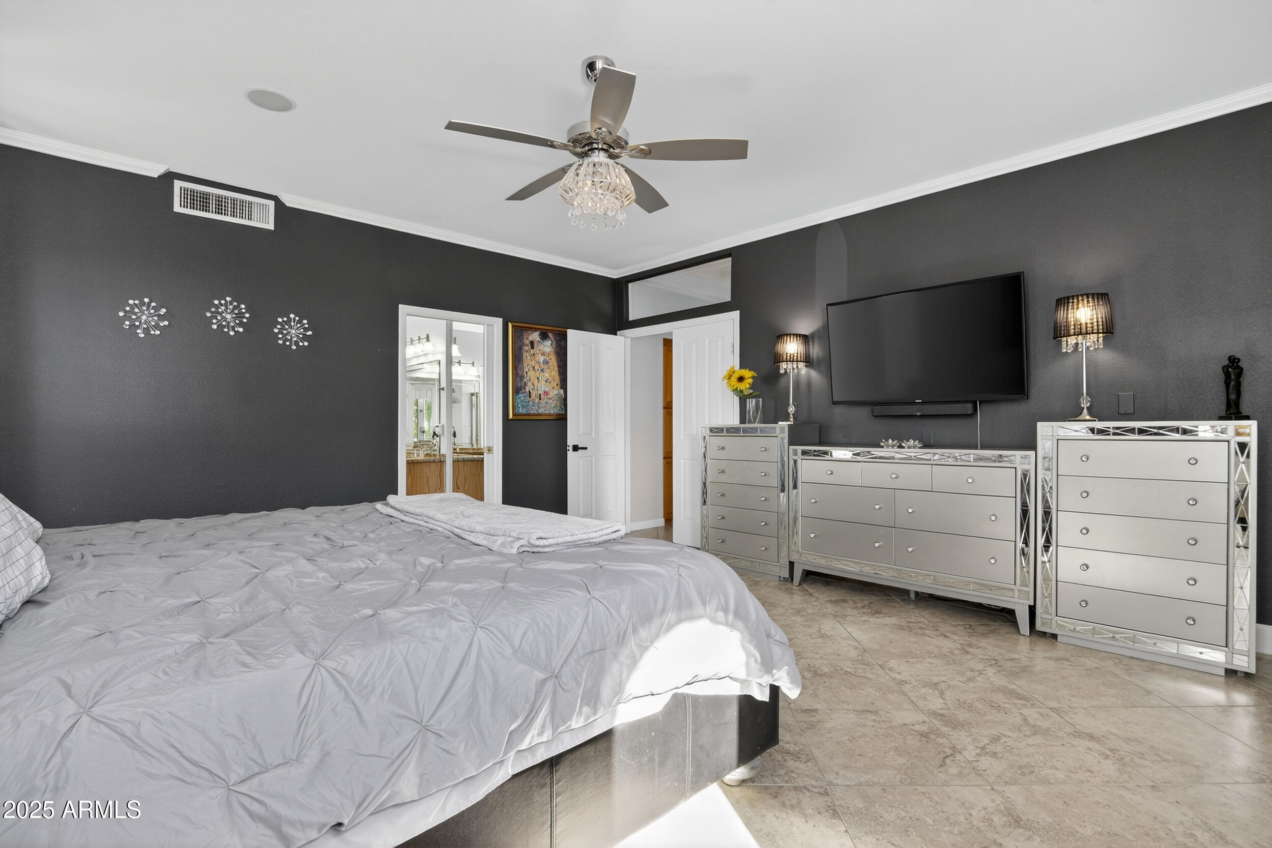 1614 East Kathleen Road Phoenix, AZ 85022 - Photo 15 of 30 a bedroom with a bed flat screen tv and a ceiling fan