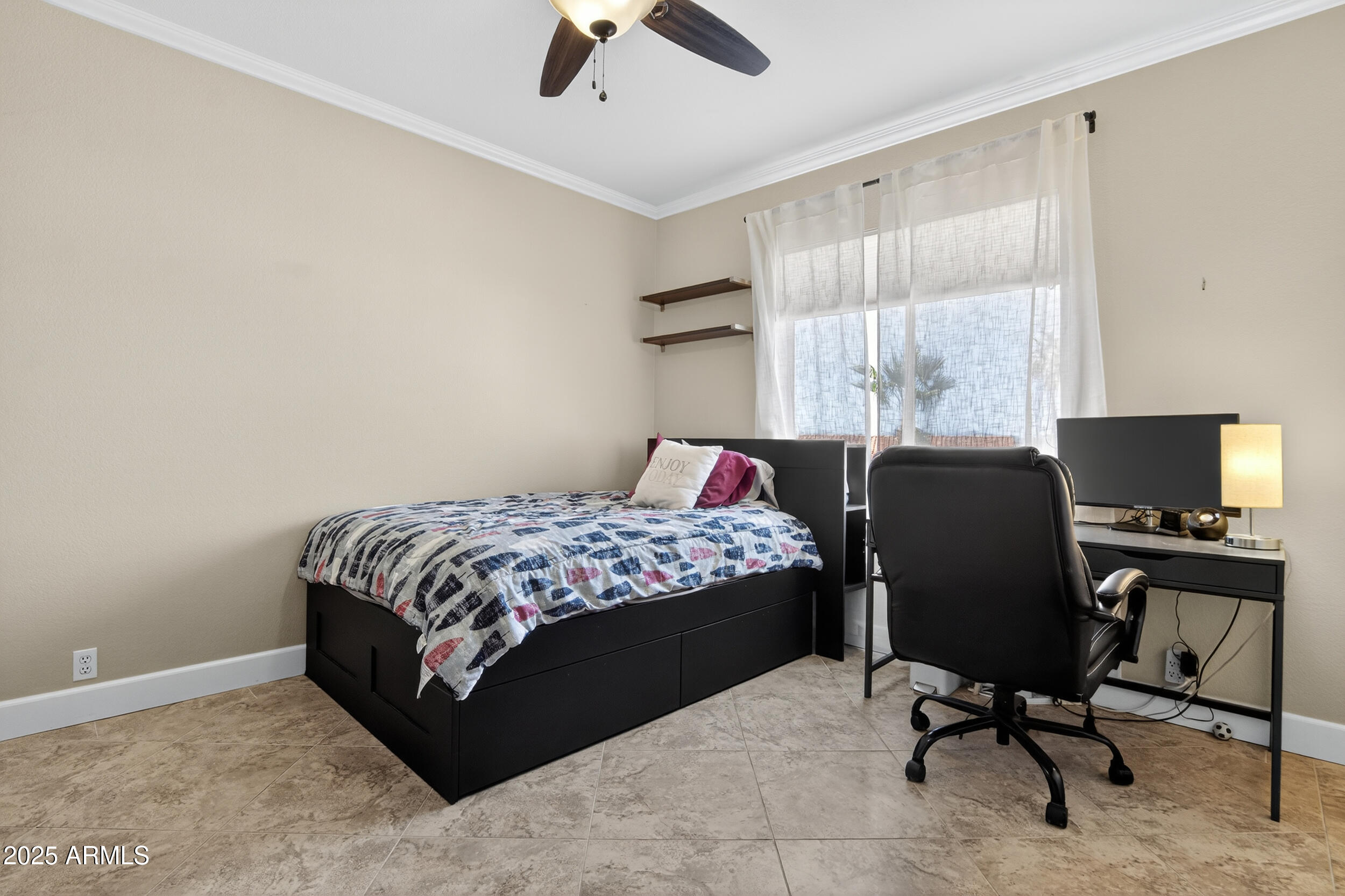 1614 East Kathleen Road Phoenix, AZ 85022 - Photo 21 of 30 a bedroom with a bed and a chair