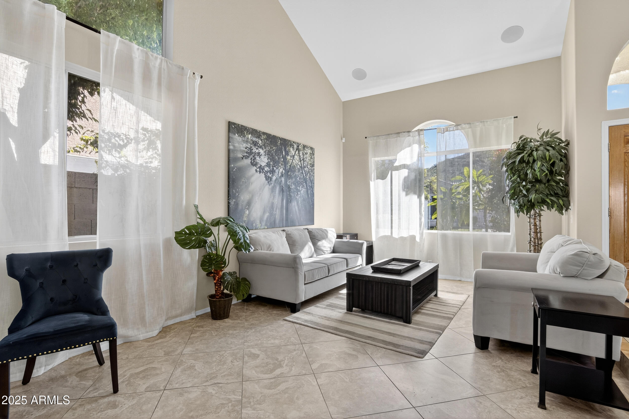 1614 East Kathleen Road Phoenix, AZ 85022 - Photo 5 of 30 a living room with furniture and a large window