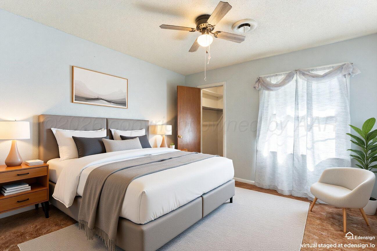 4305 South Bonham Street Amarillo, TX 79110 - Photo 30 of 48 a bedroom with a bed and a chair
