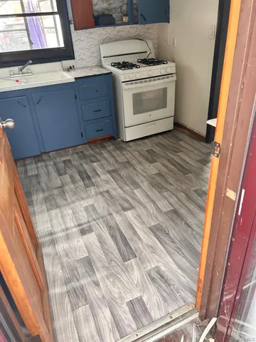 a kitchen with a stove and cabinets