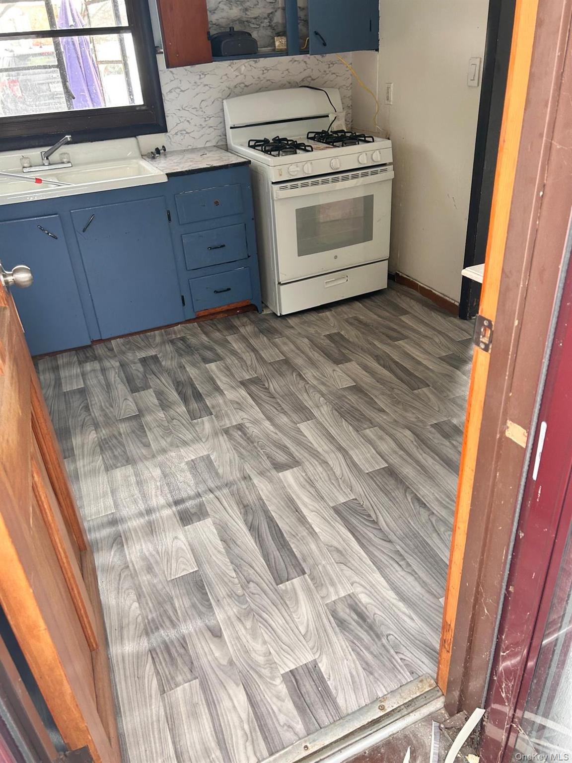 5 Goldman Road, Unit A Monroe, NY 10950 - Photo 2 of 6 a kitchen with a stove and cabinets