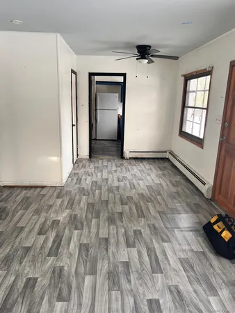 a view of an empty room and window