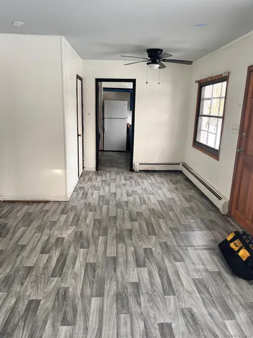 a view of an empty room and window