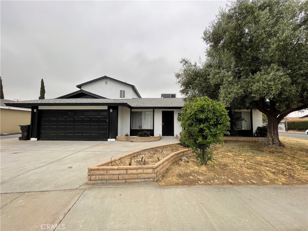 311 East Fromer Street Rialto, CA 92376 - Photo 1 of 1 a front view of a house with yard