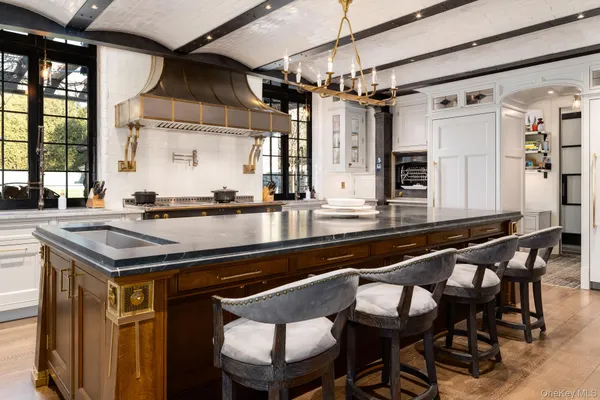 a kitchen with a table and chairs in it