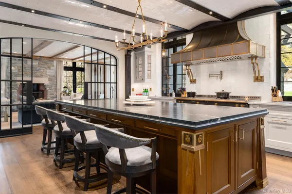 a kitchen with a sink cabinets and window