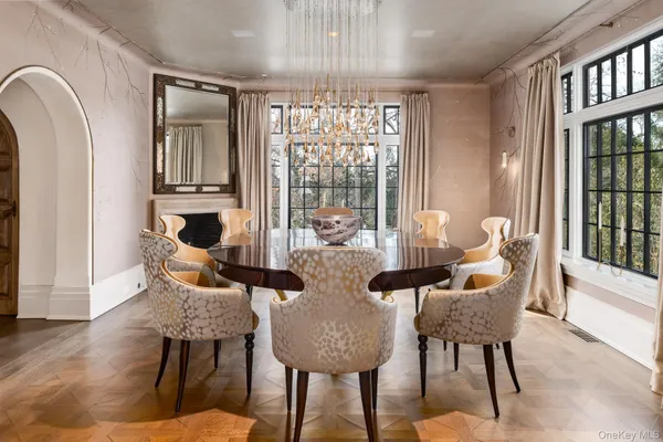 a view of a dining room with furniture and window