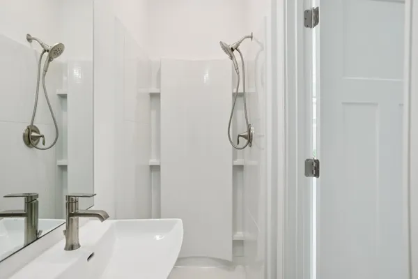 a bathroom with a shower and a shower
