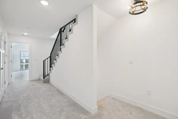 a view of a hallway with staircase