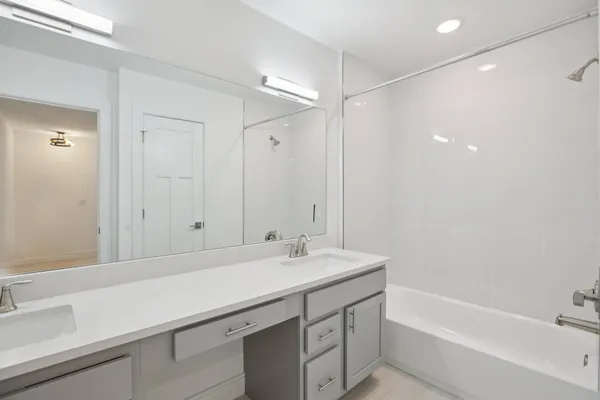 a bathroom with a sink and a bathtub