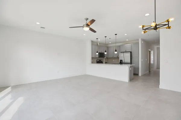 a view of a kitchen with a sink and cabinets