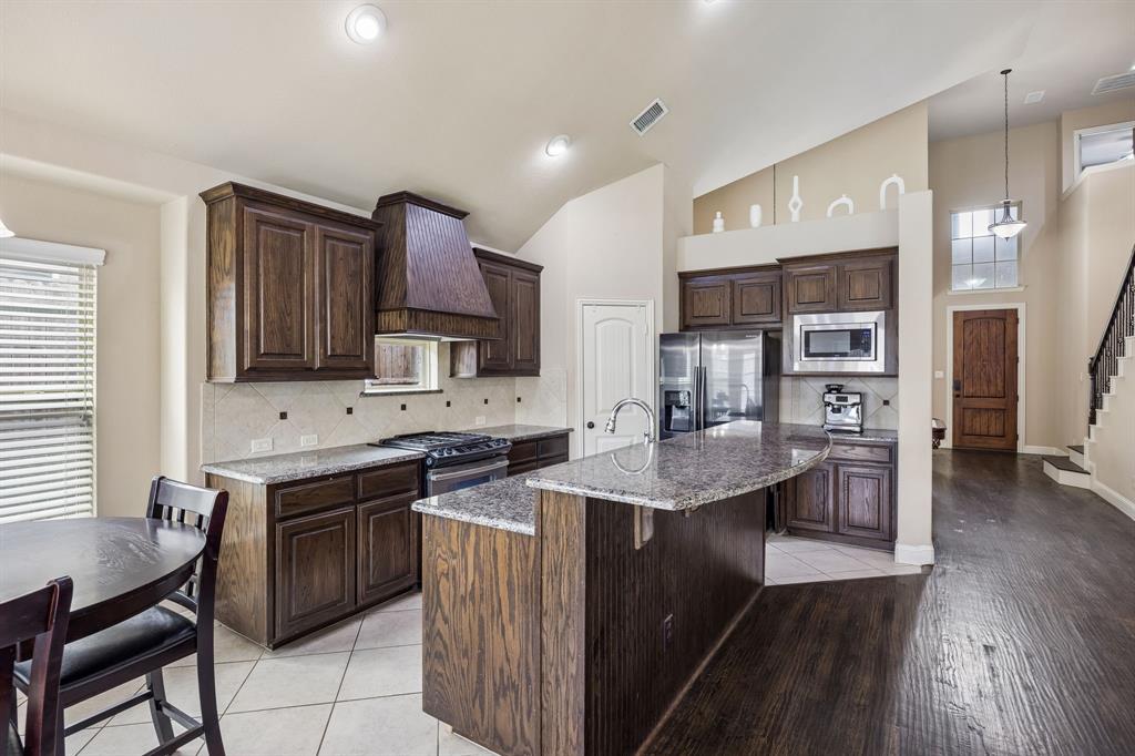 1014 Dunhill Lane Forney, TX 75126 - Photo 11 of 38 Another view of the kitchen from the breakfast