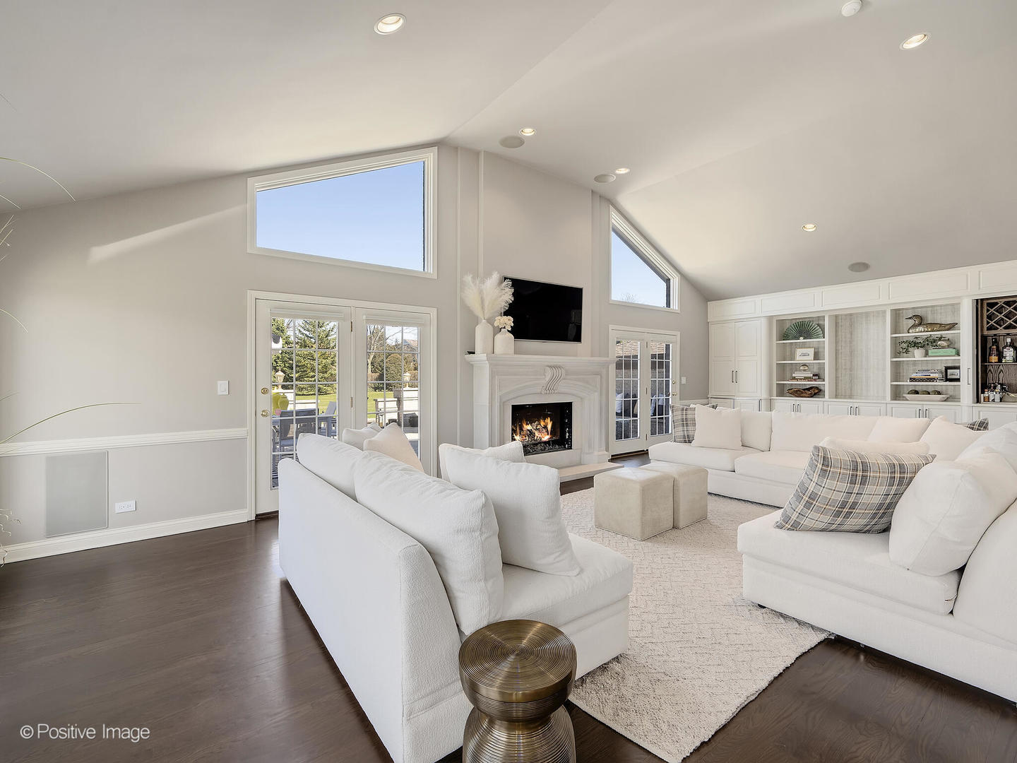 8151 Lake Ridge Drive Burr Ridge, IL 60527 - Photo 17 of 46 a living room with furniture a fireplace and a large window