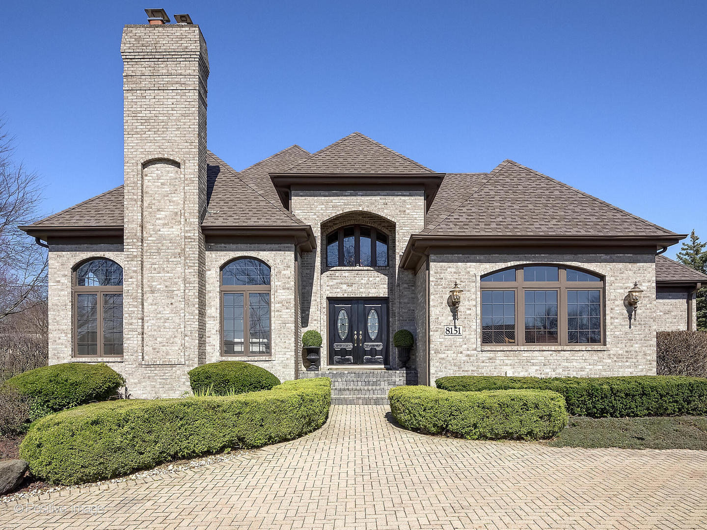 8151 Lake Ridge Drive Burr Ridge, IL 60527 - Photo 2 of 46 a front view of a house with a yard