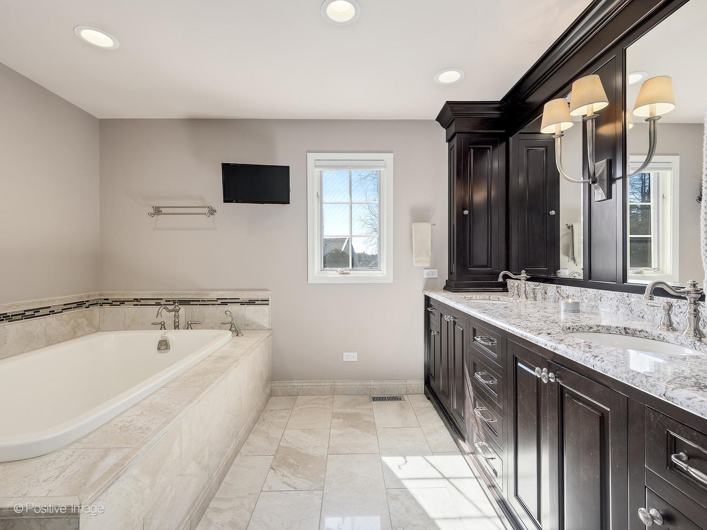 8151 Lake Ridge Drive Burr Ridge, IL 60527 - Photo 22 of 46 a spacious bathroom with a granite countertop sink mirror and bathtub