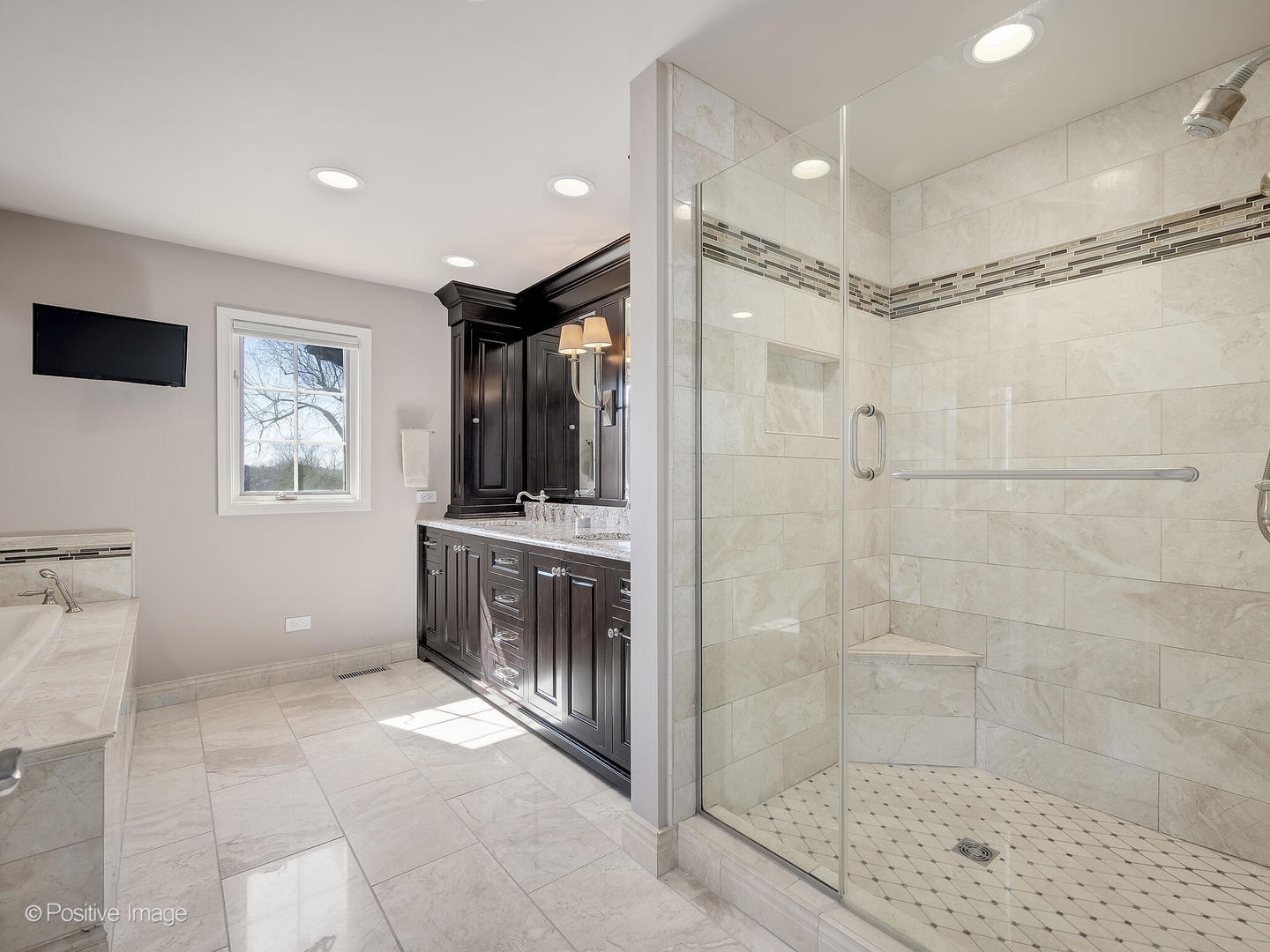 8151 Lake Ridge Drive Burr Ridge, IL 60527 - Photo 23 of 46 a spacious bathroom with a mirror a shower and a sink