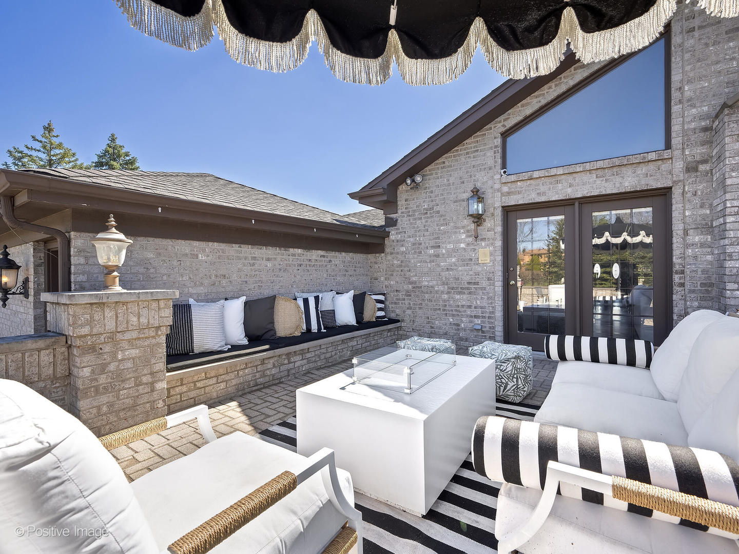 8151 Lake Ridge Drive Burr Ridge, IL 60527 - Photo 37 of 46 a view of a patio with couches table and chairs and potted plants