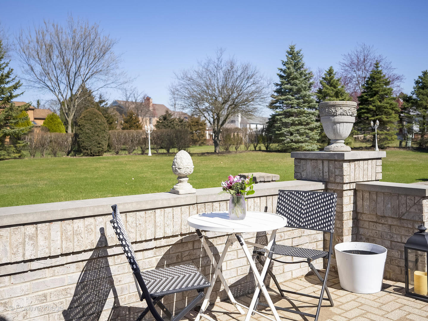 8151 Lake Ridge Drive Burr Ridge, IL 60527 - Photo 40 of 46 a view of a patio with a table and chairs and potted plants