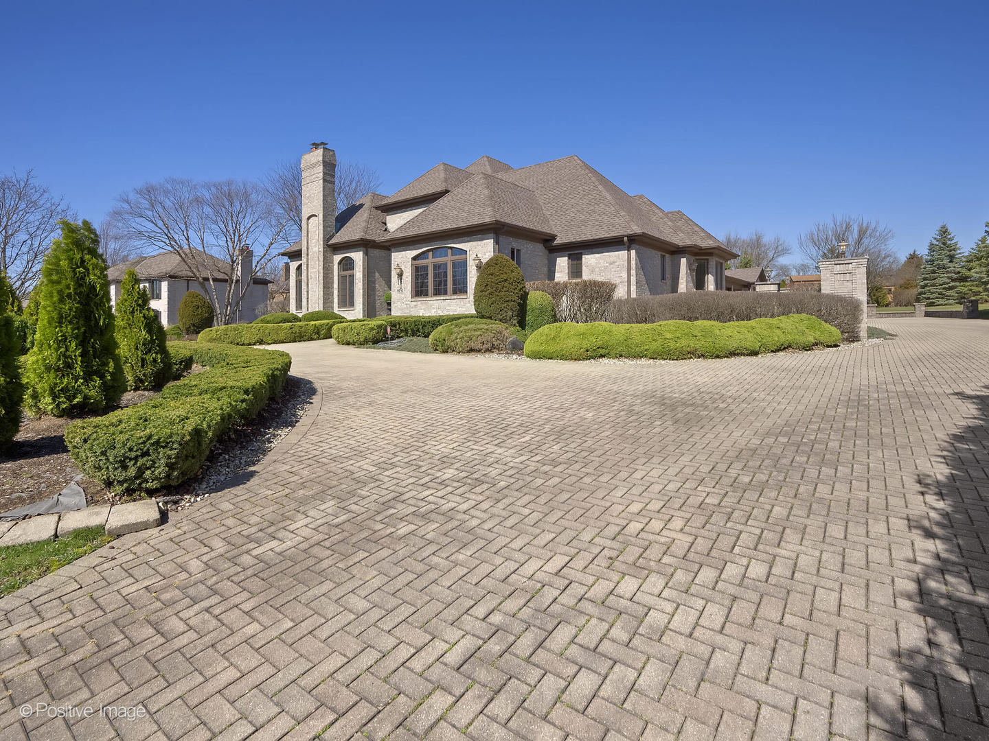 8151 Lake Ridge Drive Burr Ridge, IL 60527 - Photo 43 of 46 a front view of a house with a yard and garage