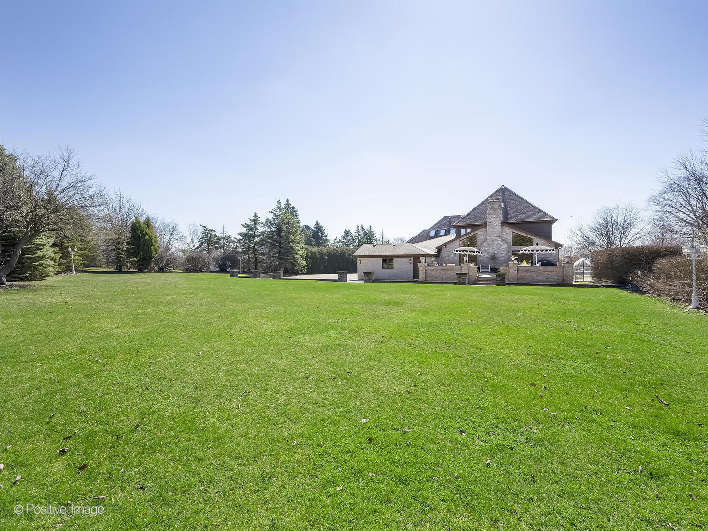 8151 Lake Ridge Drive Burr Ridge, IL 60527 - Photo 45 of 46 a front view of a house with garden