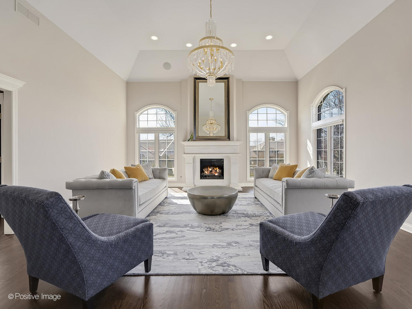 8151 Lake Ridge Drive Burr Ridge, IL 60527 - Photo 5 of 46 a living room with furniture chandelier and a fireplace
