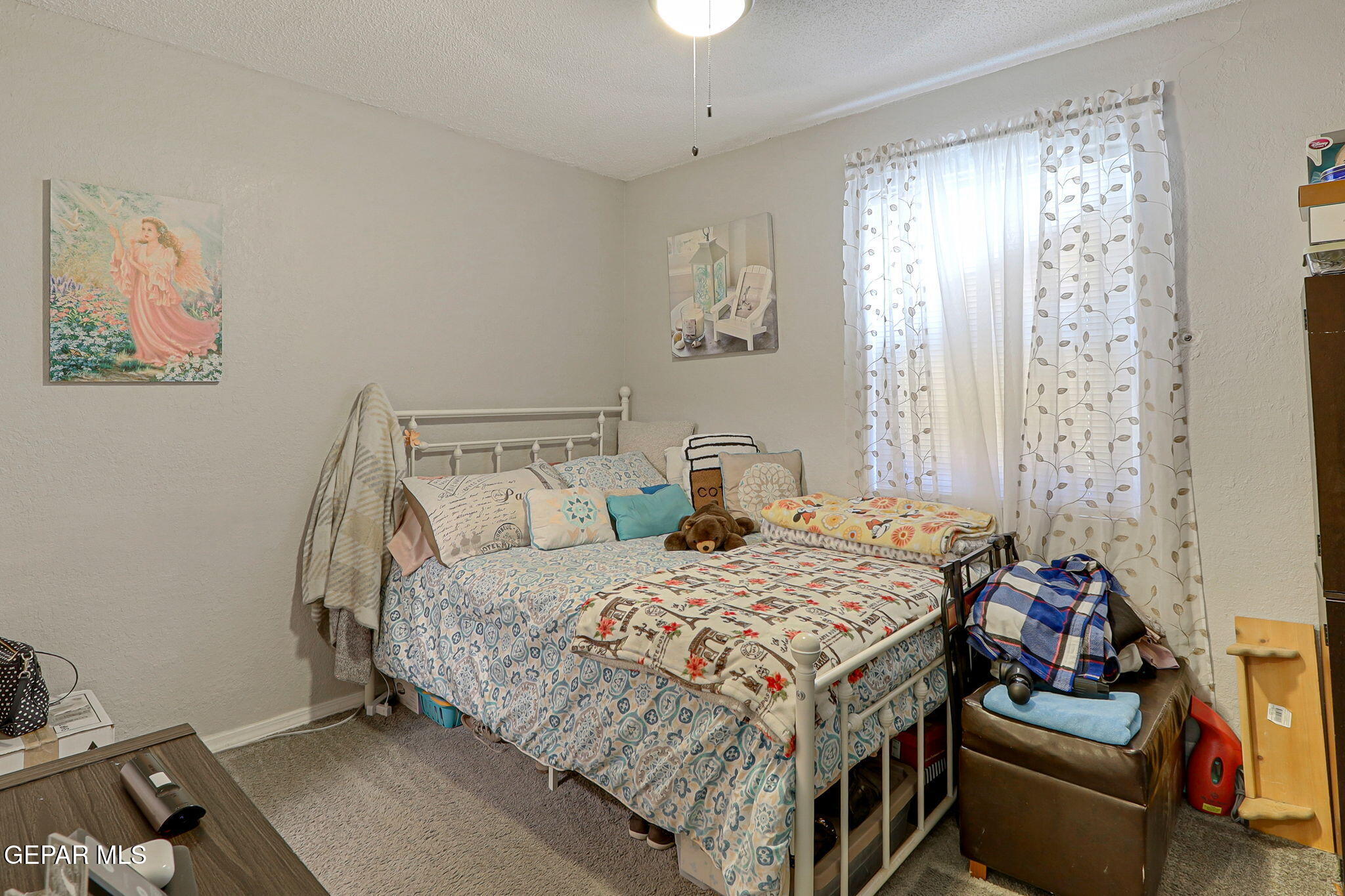 8339 White Road El Paso, TX 79907 - Photo 11 of 31 a bedroom with a bed and a window