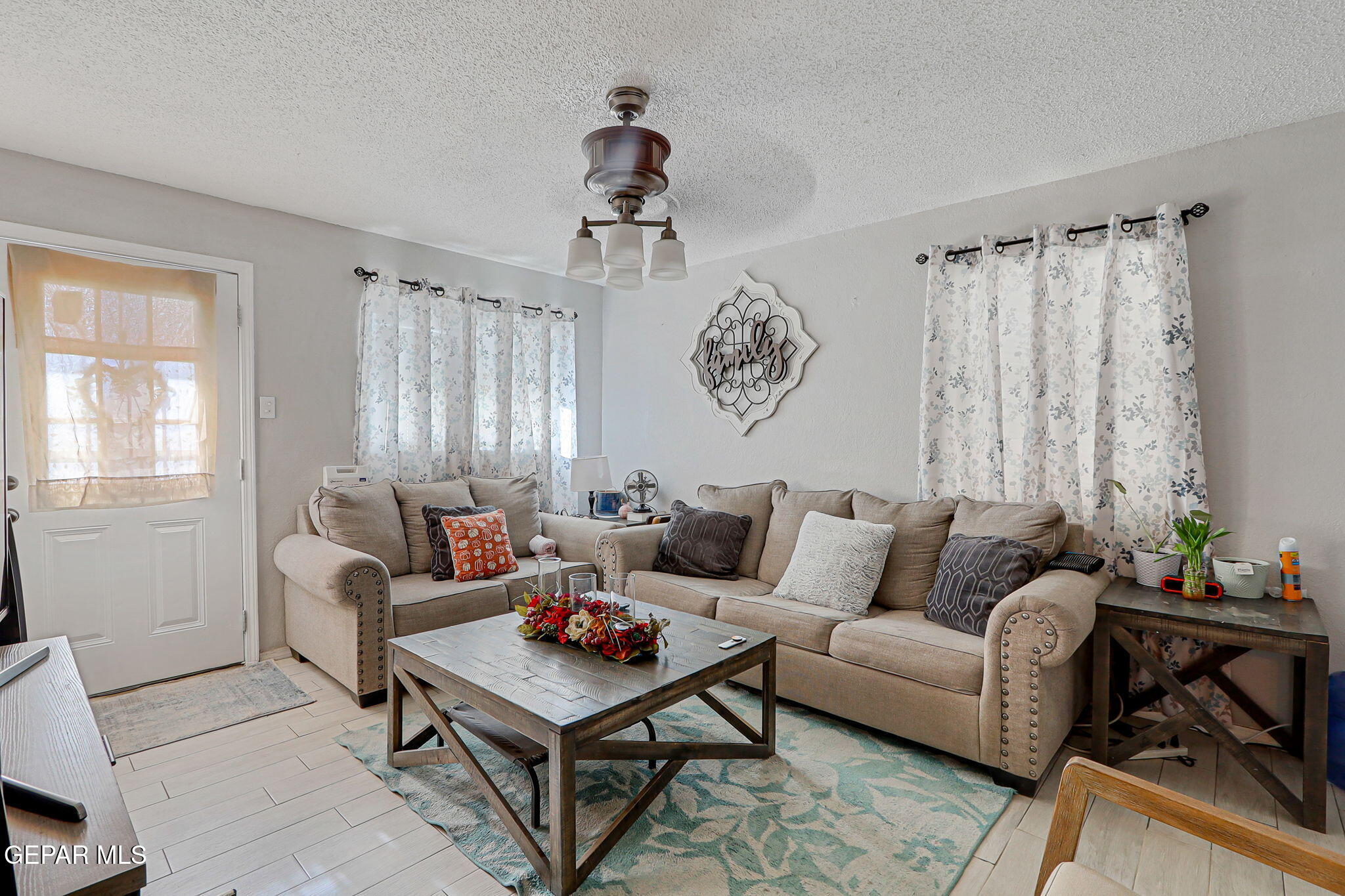 8339 White Road El Paso, TX 79907 - Photo 30 of 31 a living room with furniture and a window