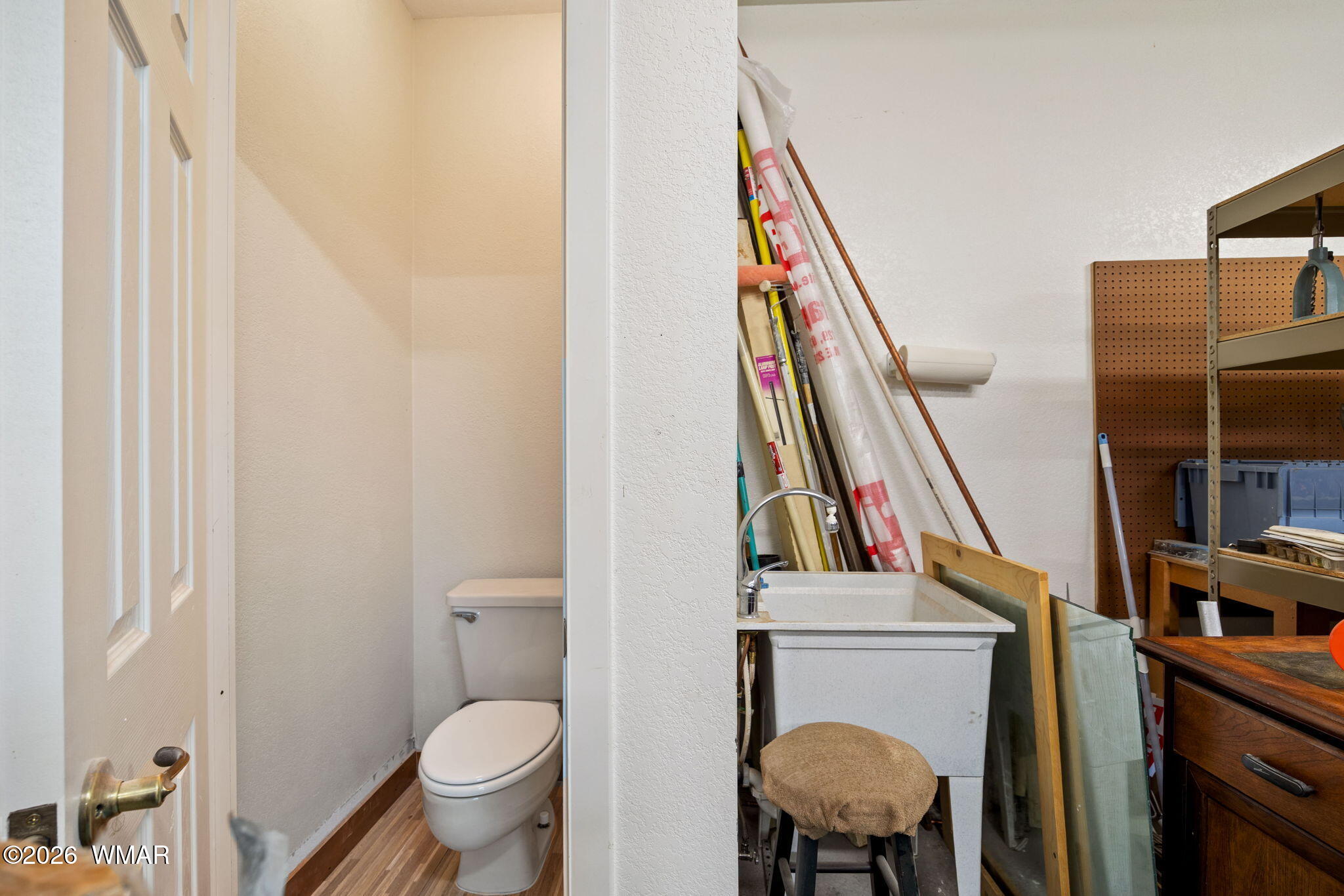 2924 Pine Rim Road Overgaard, AZ 85933 - Photo 29 of 43 a bathroom with a toilet a sink and a mirror