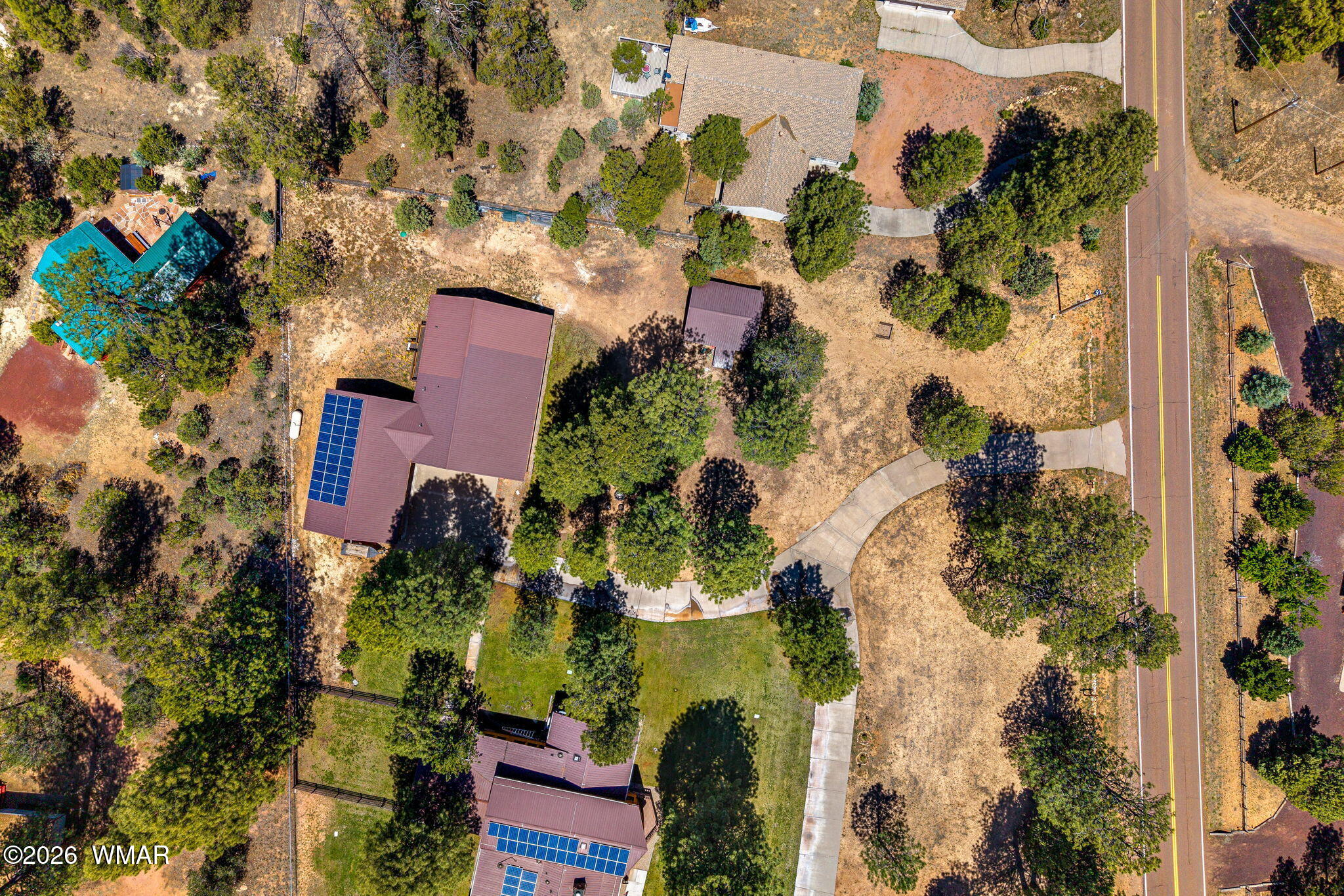 2924 Pine Rim Road Overgaard, AZ 85933 - Photo 40 of 43 an aerial view of a house with a yard and garden