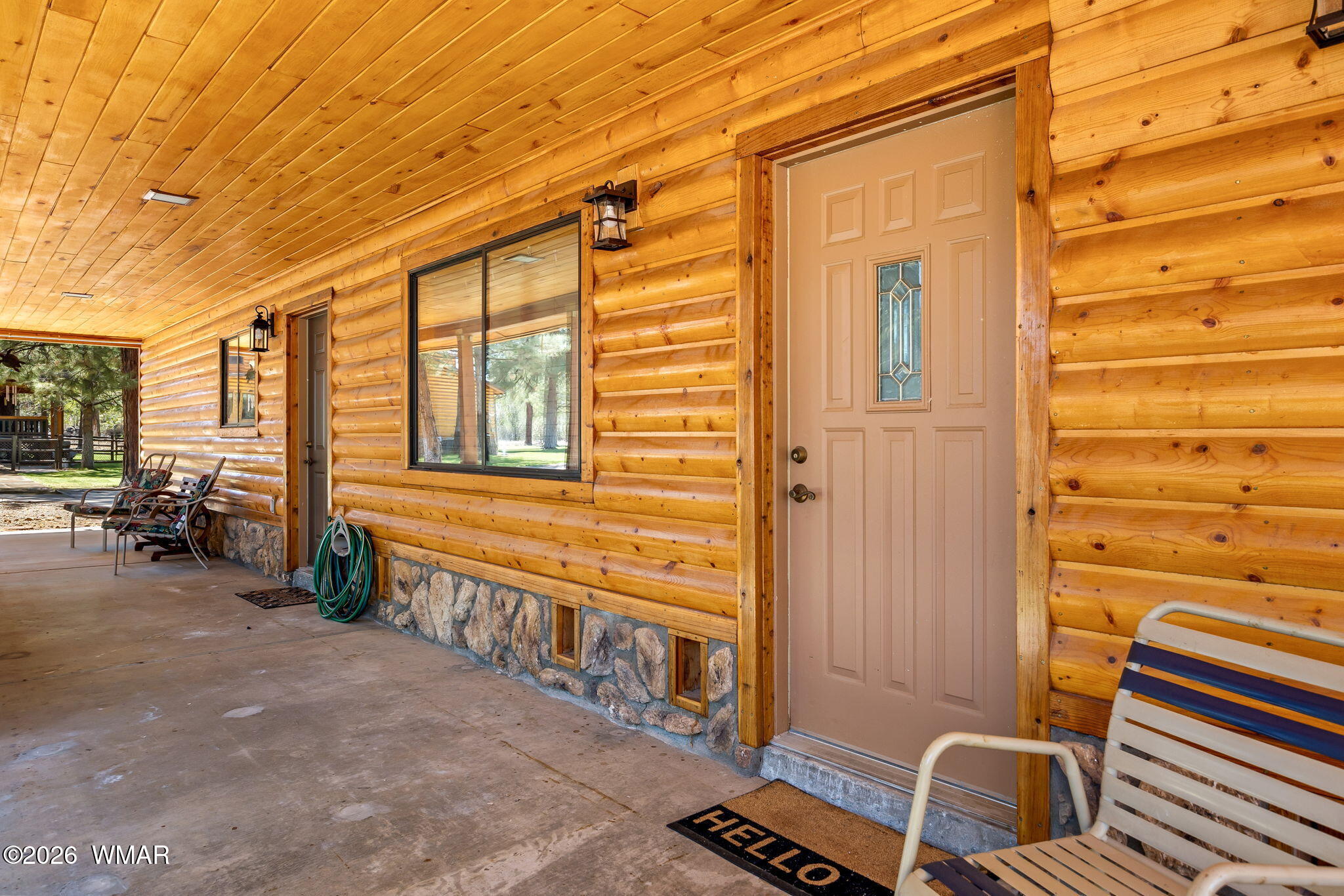 2924 Pine Rim Road Overgaard, AZ 85933 - Photo 6 of 43 a view of a porch with a table and chairs