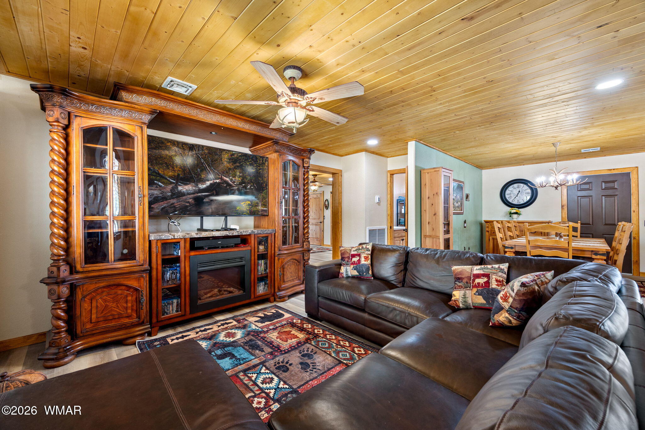 2924 Pine Rim Road Overgaard, AZ 85933 - Photo 7 of 43 a living room with furniture a flat screen tv and a table