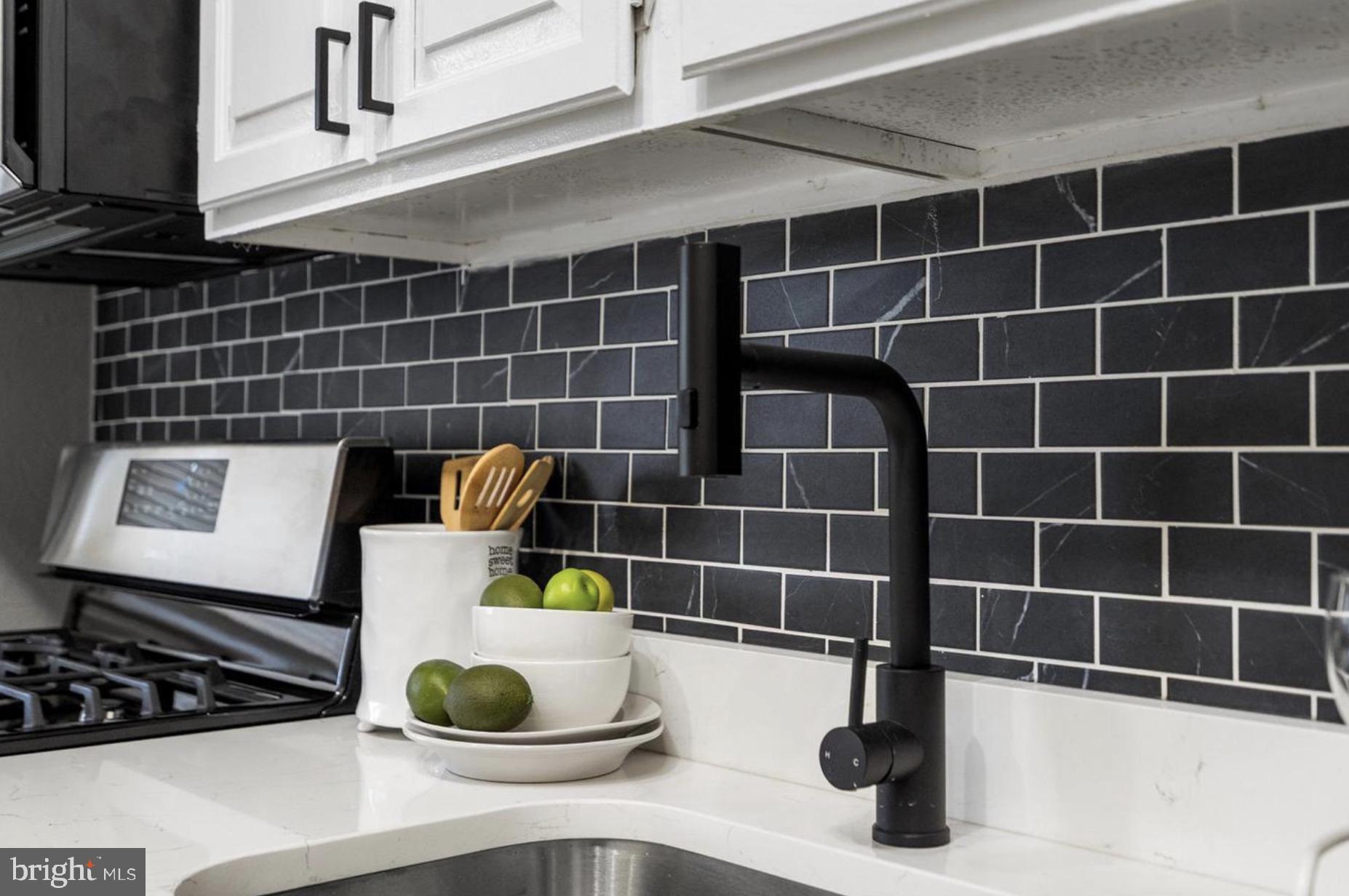 7509 Durwood Road Baltimore, MD 21222 - Photo 13 of 24 a bathroom with a sink and a mirror