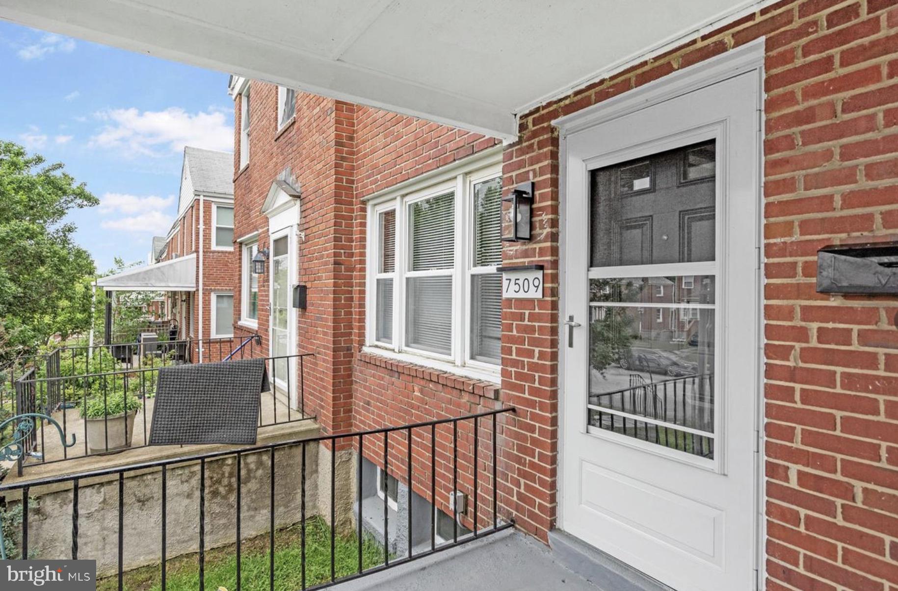7509 Durwood Road Baltimore, MD 21222 - Photo 3 of 24 a view of a house with a glass door