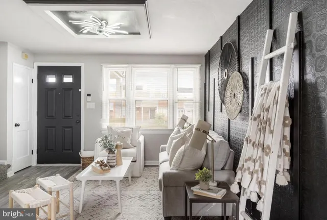 a living room with furniture and a window