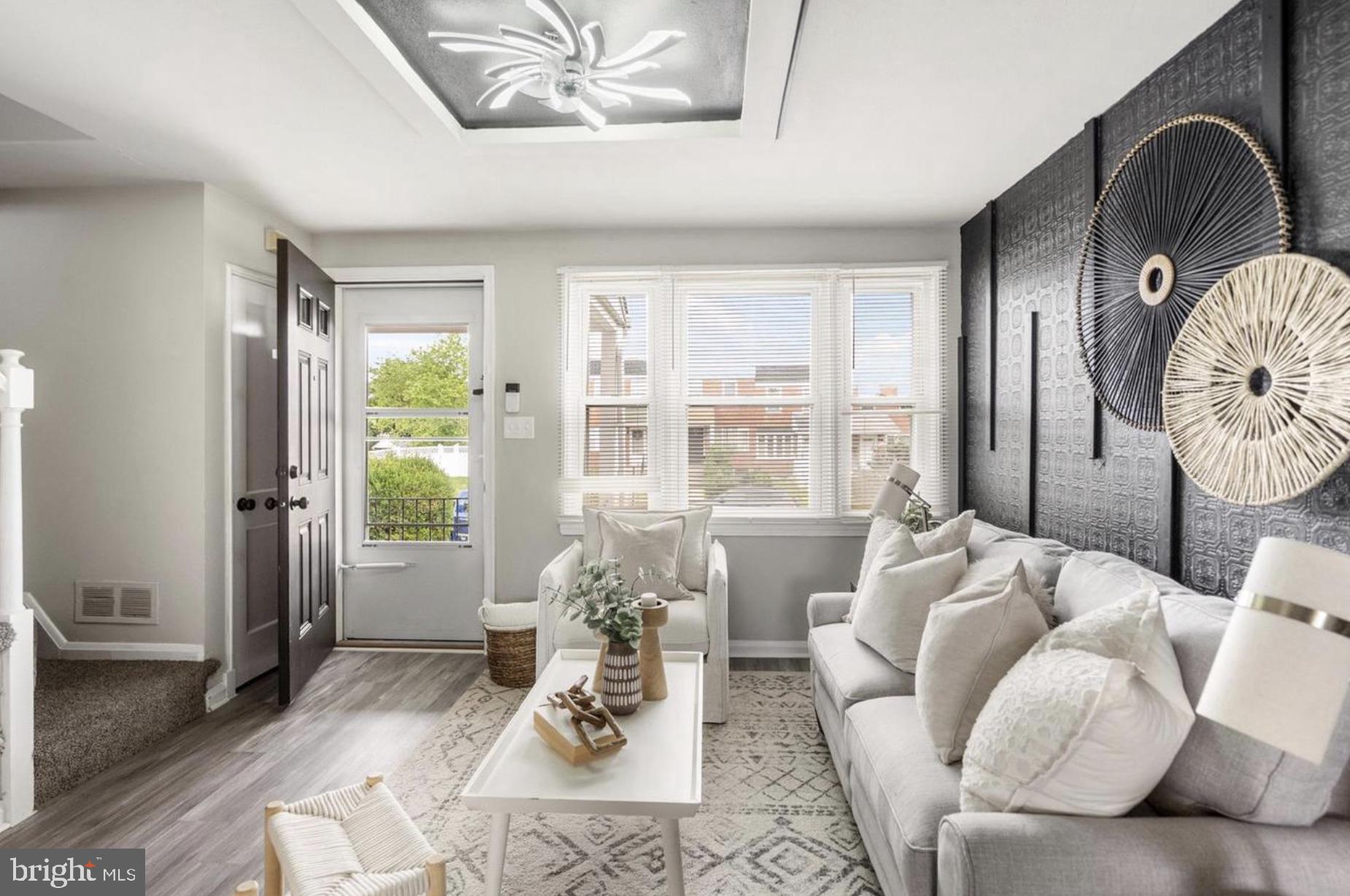 7509 Durwood Road Baltimore, MD 21222 - Photo 7 of 24 a living room with furniture and wooden floor