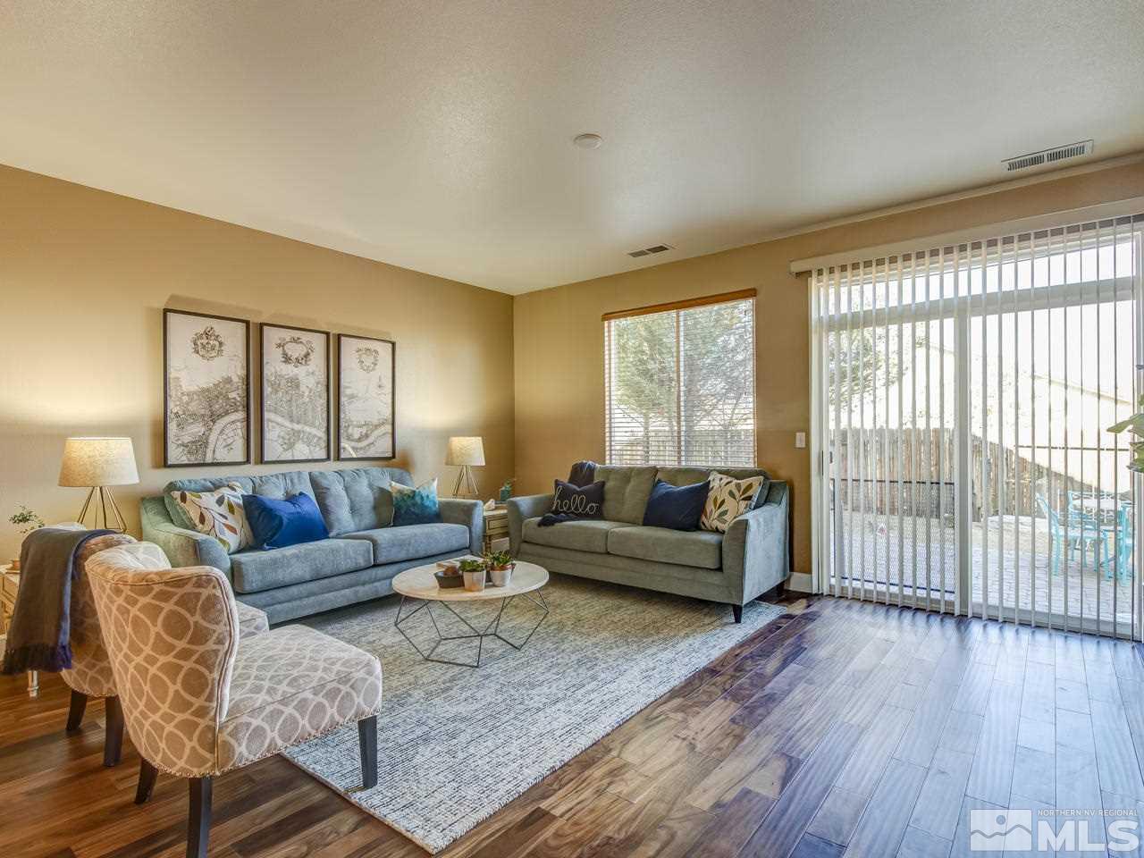 10803 Rushing Flume Drive Reno, NV 89521 - Photo 11 of 22 a living room with furniture and a large window